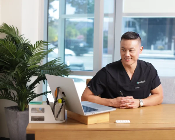 Regenics provider at desk