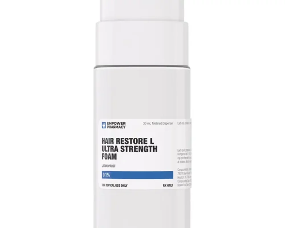 A white bottle with a blue lid, the best treatment for hair loss, on a white background.