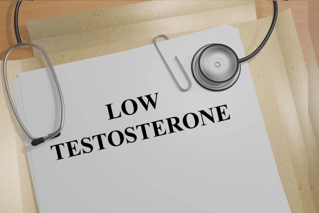 A stethoscope on a paper with the words low testosterone levels.