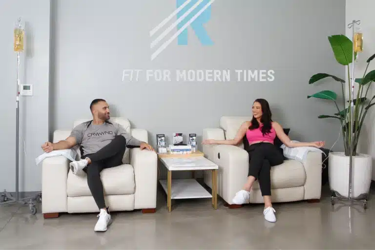 Two people sitting in REGENICS chairs in a room fit for modern times.