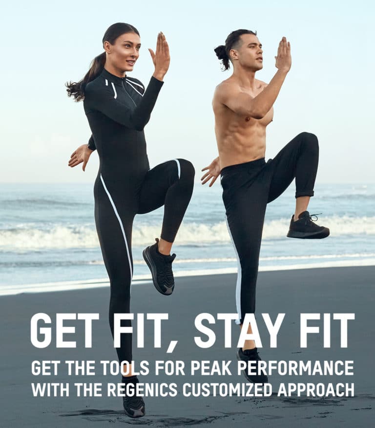 Two people exercise on a beach. The woman wears a full-body fitness outfit, and the shirtless man wears black pants. Text on the image reads: "GET FIT, STAY FIT with REGENICS. Get the tools for peak performance with the Regenics customized approach.