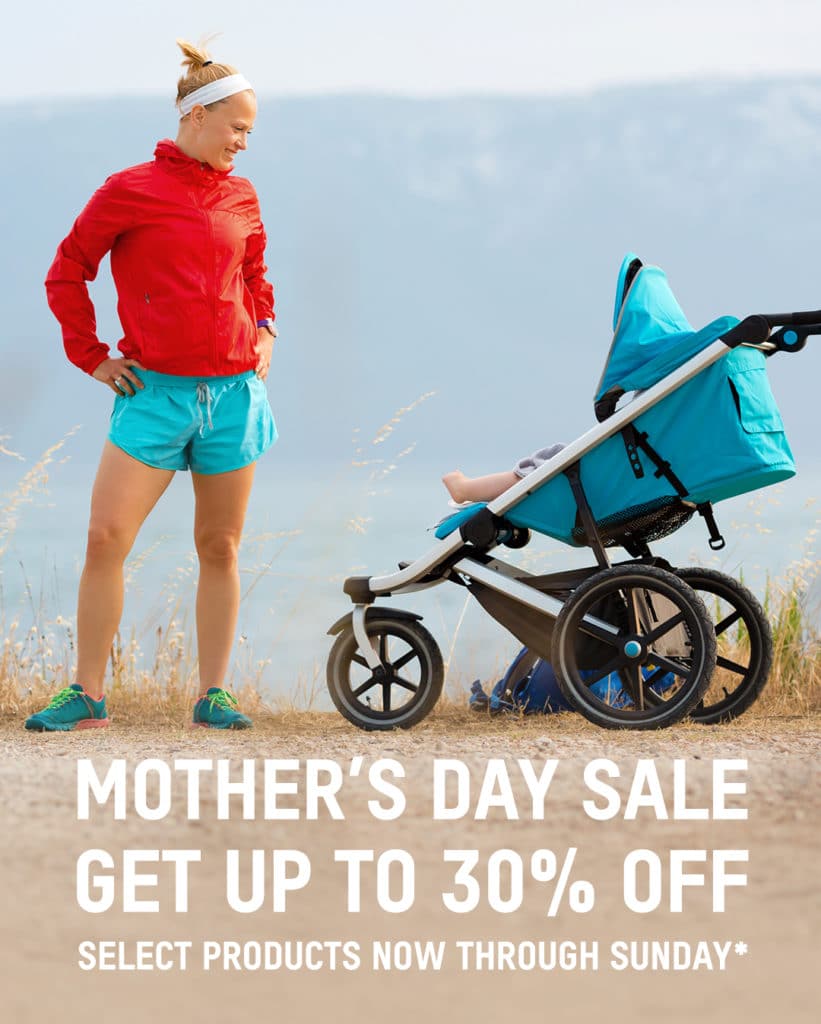 Woman in sportswear standing next to a jogging stroller on a path, with a promotional text for a Mother's Day Hydrafacial sale offering up to 30% off.